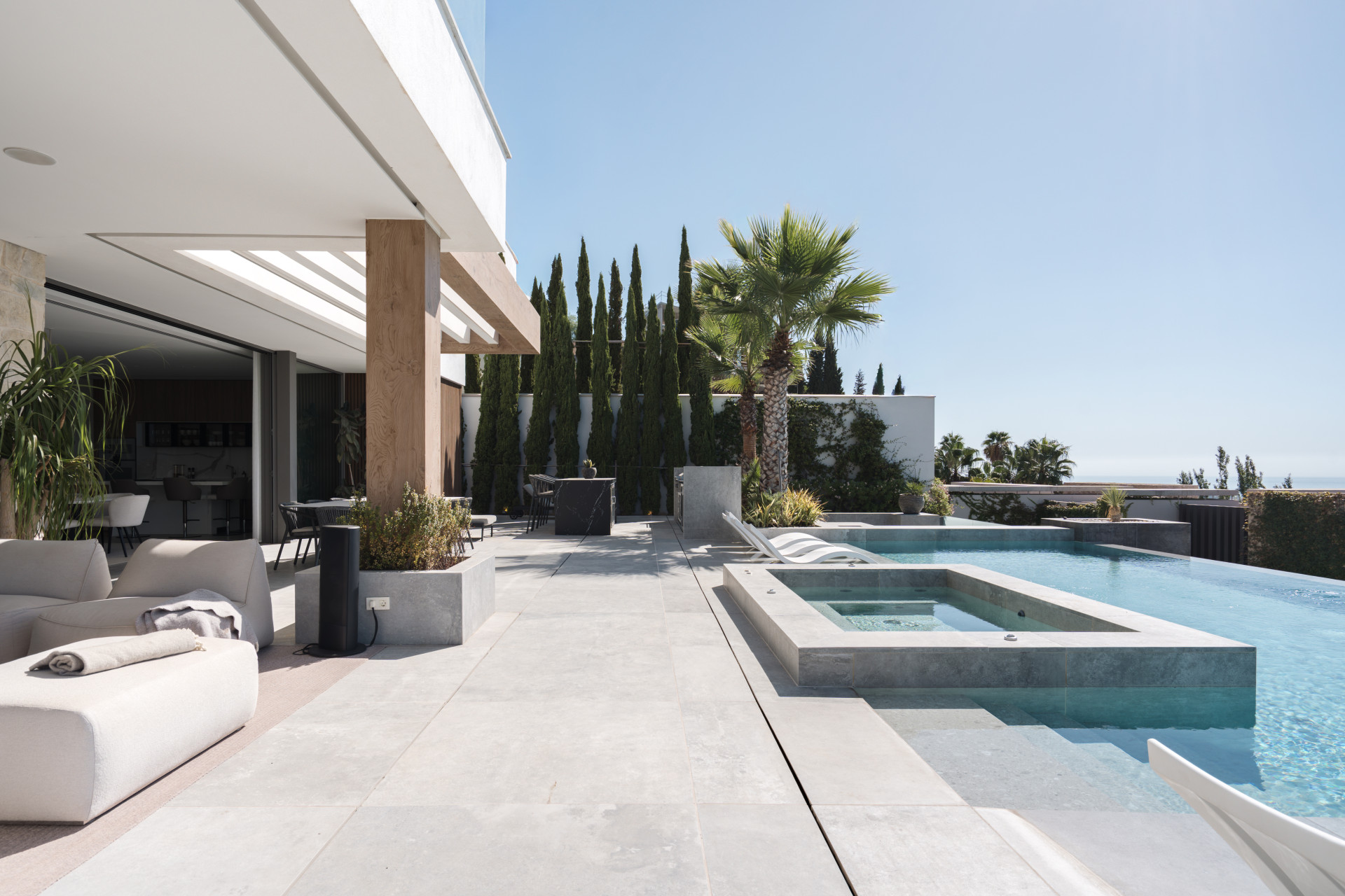 Outdoor pool framed by villa terraces — The Hills 10, La Quinta