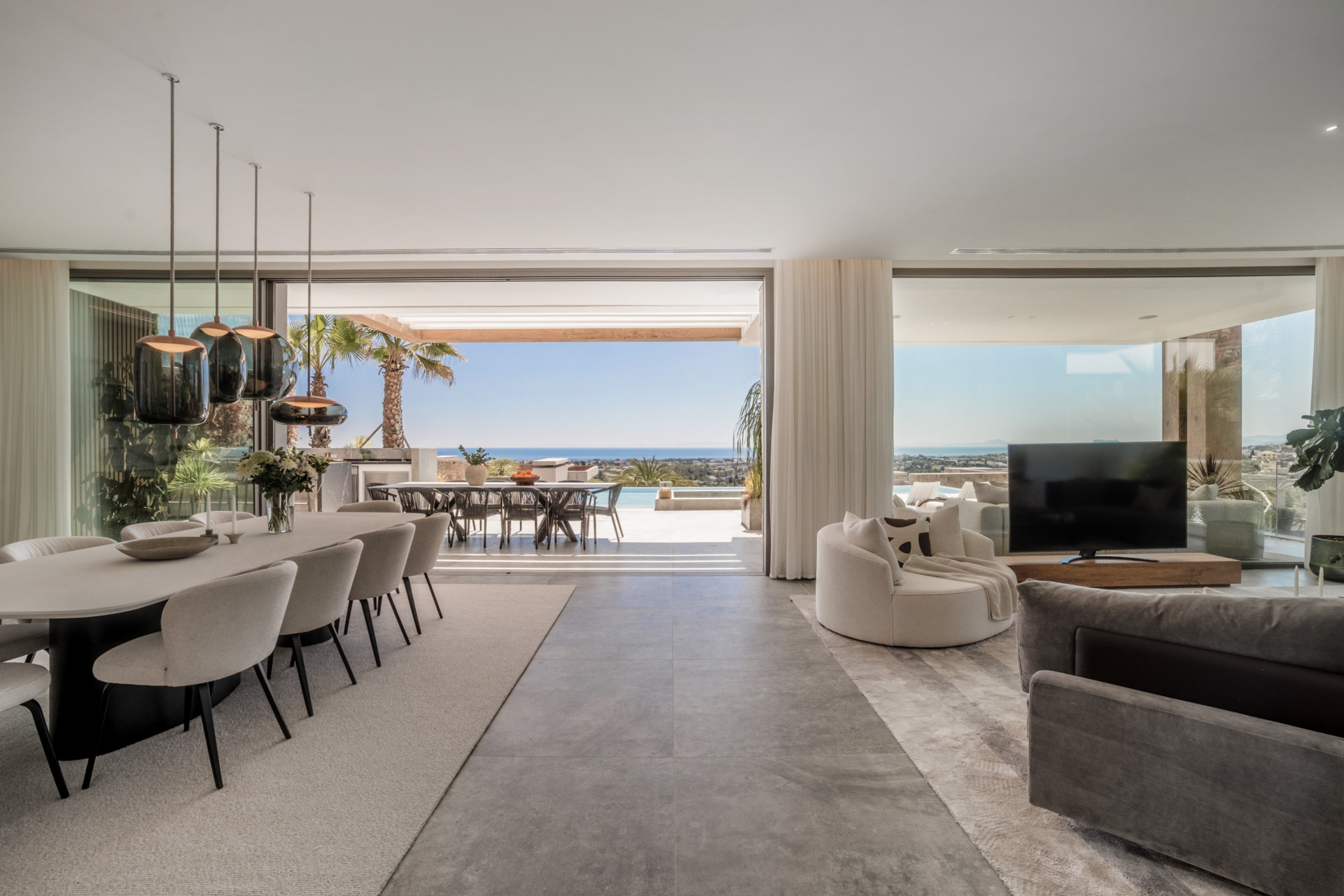 Open-plan living and dining areas with Mediterranean views — The Hills 10, La Quinta