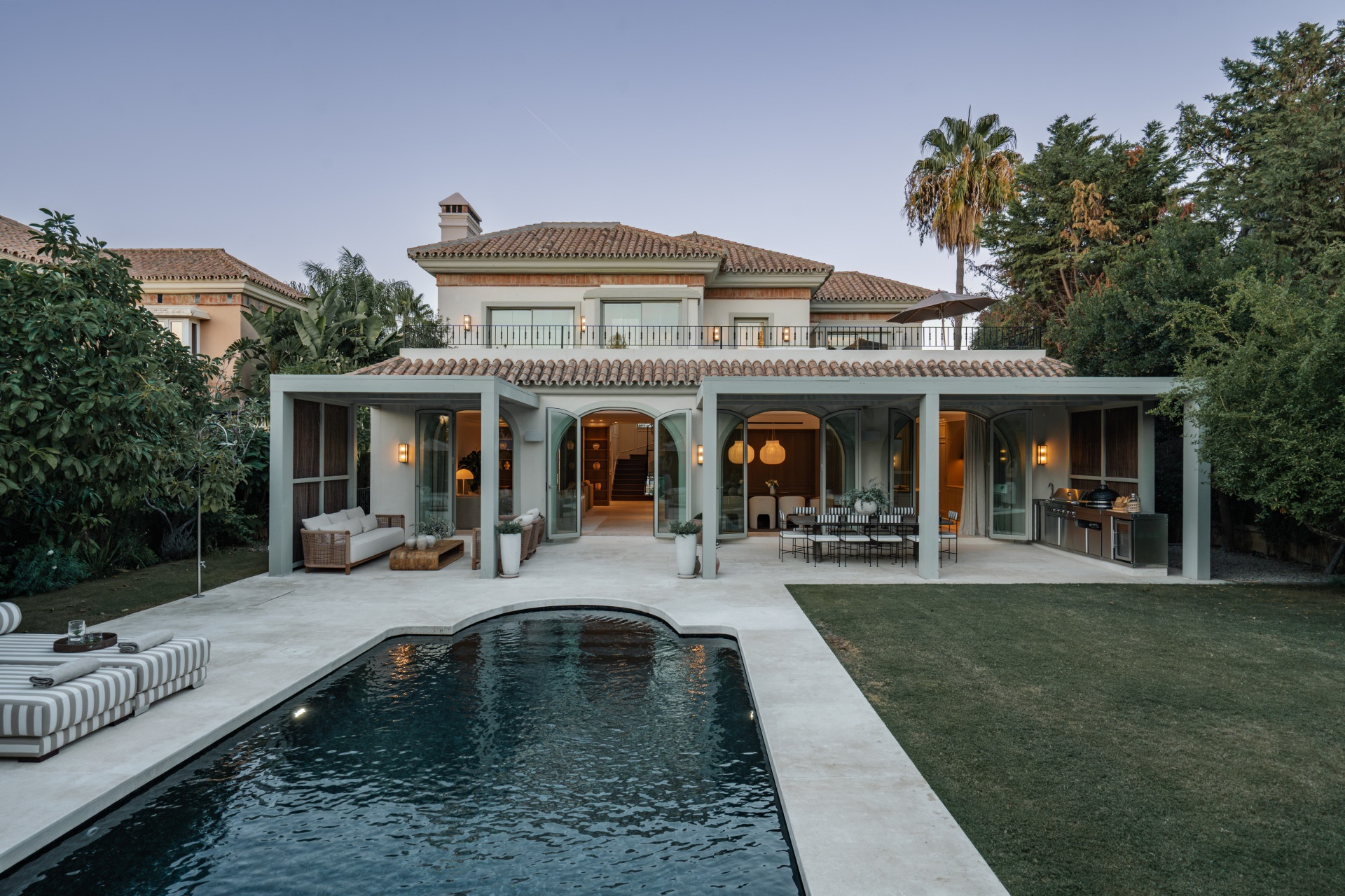 Villa exterior and pool with landscaped gardens — Villa Amelie, Nueva Andalucía