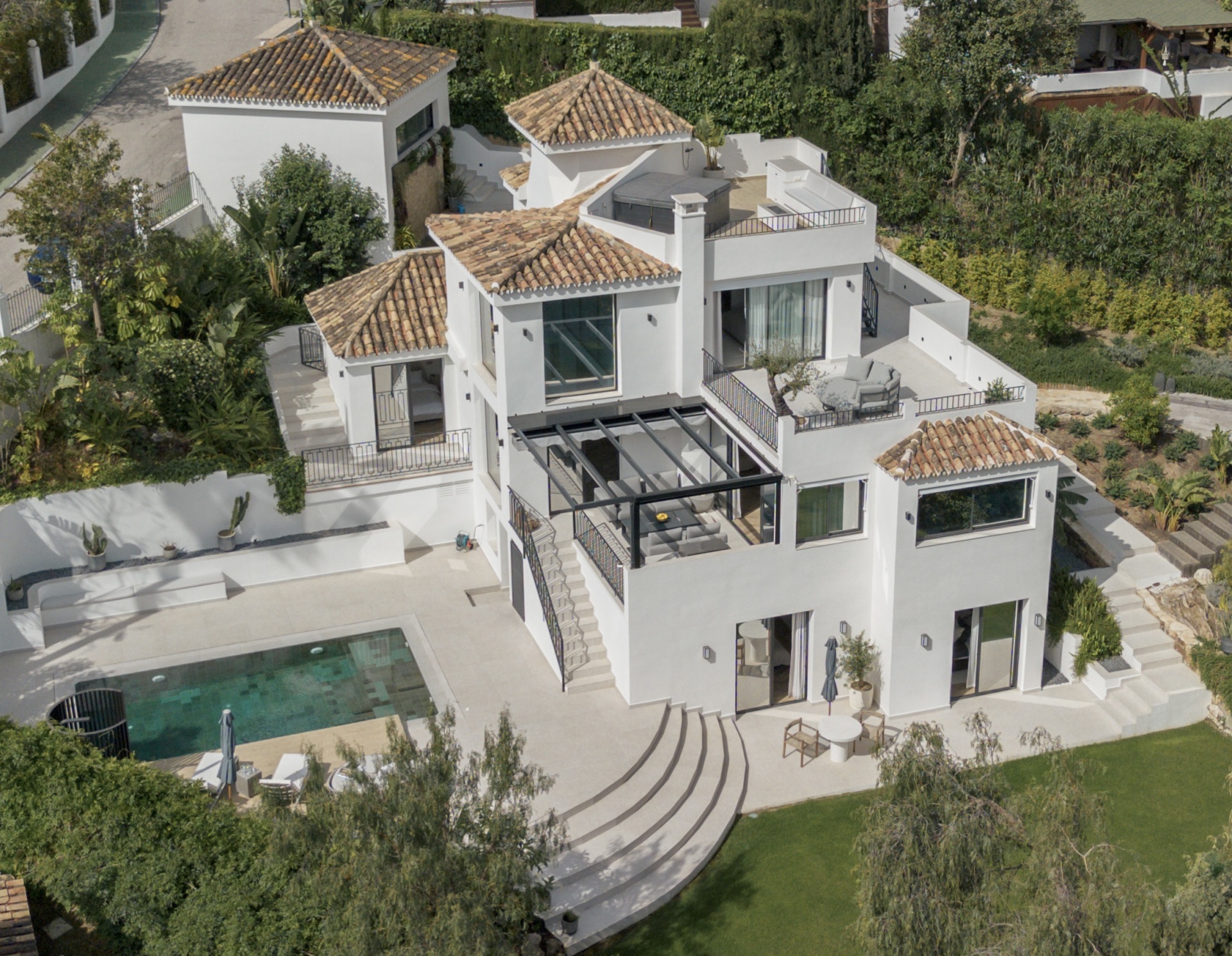 Aerial view of the renovated villa and private pool at Los Naranjos Hill Club — Nueva Andalucía