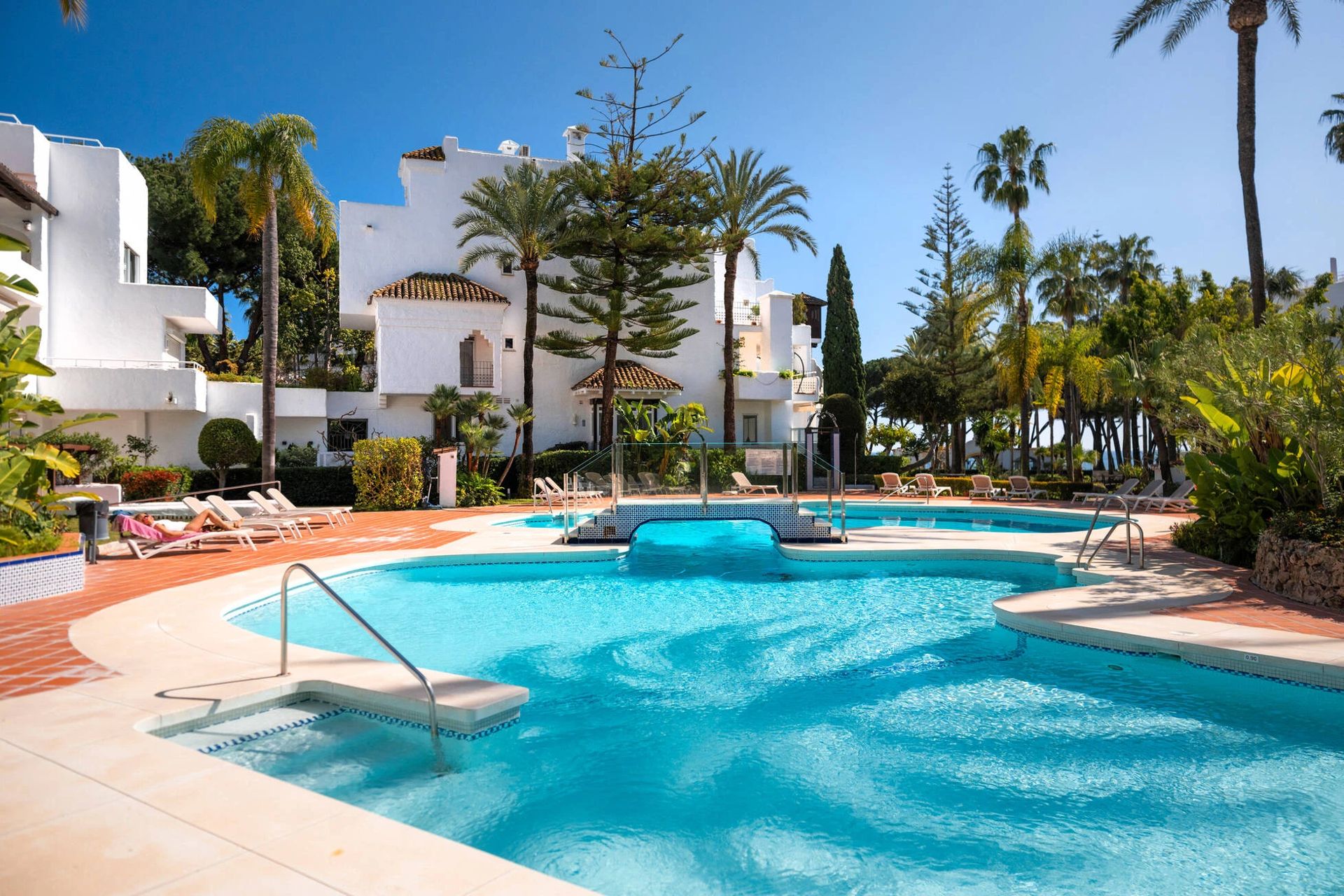 Subtropical gardens and communal pool — Alhambra del Mar, Golden Mile