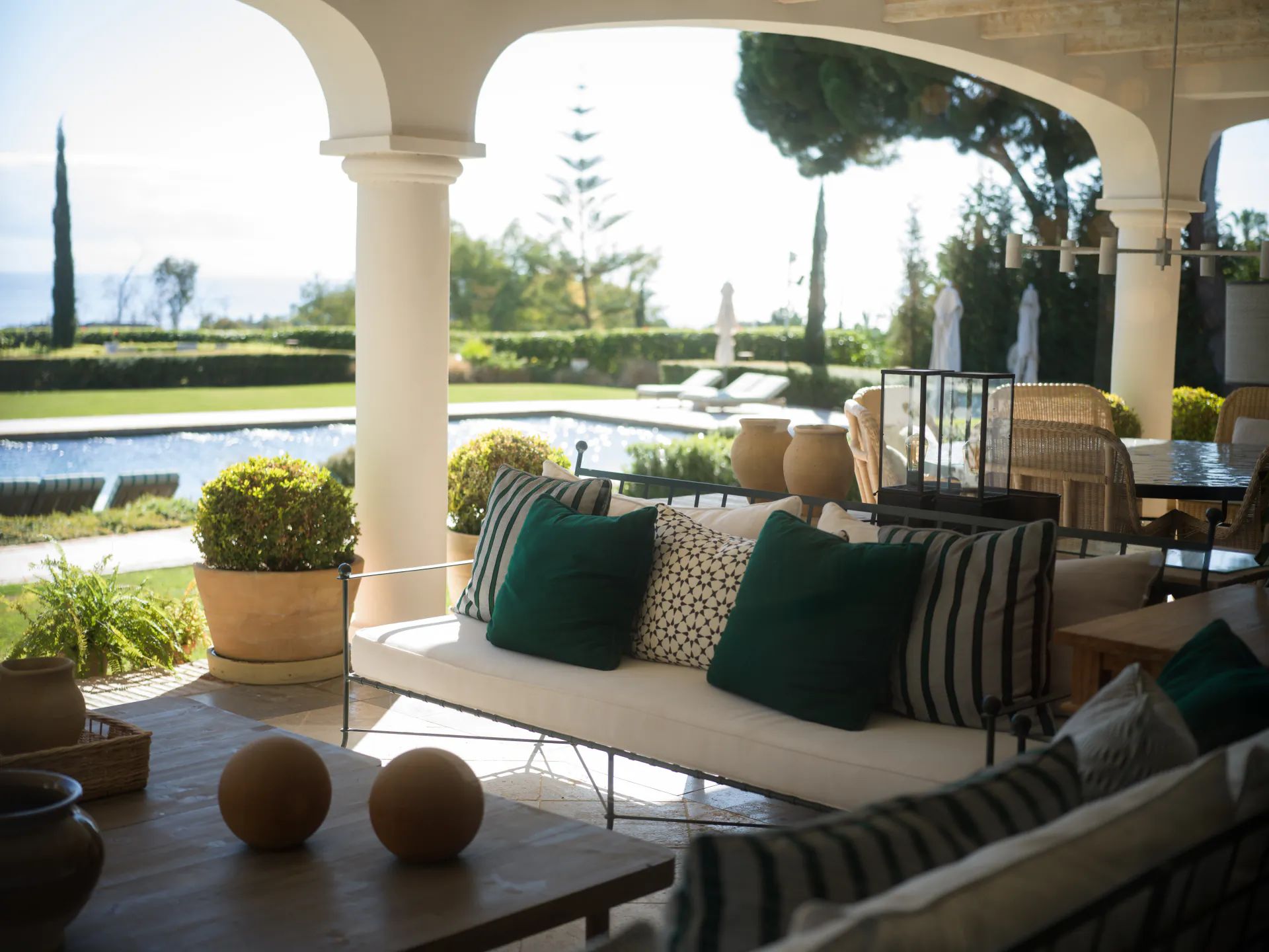 Arched terrace lounge overlooking the pool and the Mediterranean — Villa La Gratitud, Golden Mile